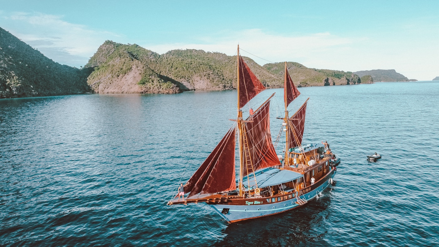 Traditional Indonesian phinisi sailing through the archipelago